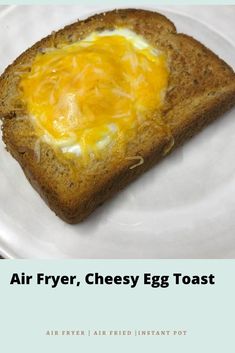 an egg toast on a white plate with the words air fryer, cheesy egg toast