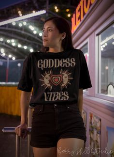 Goddess Vibes Tee, Boho Witchy Aesthetic Shirt, Graphic Tee in Black Feels soft and lightweight, with the right amount of stretch, and It's comfortable and flattering. All inks used to print are high quality, water-based and eco-friendly. This T-shirt is unisex sizing - it is larger than your typical woman's t-shirts. Please use the sizing guide for best fit - you can use your own T-shirt to compare measurements: see the sizing chart provided in product photos. Fabrication Solid Colours - 100% A Mystical Gifts, Spiritual Outfits, Witchy Outfits, Goddess Vibes, Athletic Aesthetic, Gifts Boho, Goddess Aesthetic, Witchy Aesthetic, Aesthetic Shirt