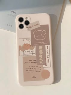 an iphone case with some stickers on it