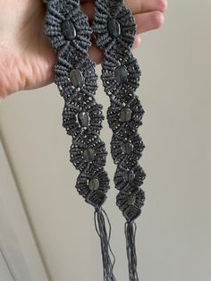 "Beautiful gray macrame belt. Only 1 available in this color and with these beads. The beads are not completely gray, they have a blue-gray color.  Check out the pictures to see how the belt looks like in different lighting.  Measurements:  Total length:  51.5\" Macrame part:  27.5\" Each tassel:  12\" Width: 1.5\" Follow @magnifique.macrame on Instagram!" Handmade Adjustable Artisan Belt, Handmade Artisan Adjustable Belt, Bohemian Adjustable Belt For Festivals, Adjustable Bohemian Belt For Festivals, Macrame Belt, Rustic Accessories, Handmade Belt, Festival Belt, Handmade Belts