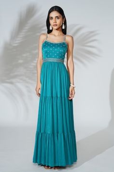 Teal blue modal satin silk padded tiered gown with silver zari and pearls hand embroidery. - Aza Fashions Festive Tiered Wedding Dress, Elegant Tiered Festive Dresses, Elegant Festive Tiered Dresses, Blue Sleeveless Maxi Dress For Festive Occasions, Festive Blue Sleeveless Maxi Dress, Sleeveless Blue Dress For Reception, Gowns Blue, Tiered Gown, Gown For Women