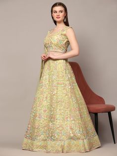 Introducing our glamorous light yellow sequins net engagement wear lehenga choli, a stunning piece that is sure to make you stand out on any special occasion. This fully stitched lehenga set comes in a beautiful light yellow color, made from high-quality net material adorned with exquisite sequin work and multi-thread embroidery.
The matching choli features the same intricate sequin work and thread embroidery, while the net dupatta completes the look with sequin work, multi-thread work, and a ch Pista Green Floor-length Lehenga For Reception, Pista Green Floor-length Organza Lehenga, Green Semi-stitched Net Lehenga, Green Net Semi-stitched Lehenga, Pista Green Floor-length Lehenga For Party, Yellow Organza Lehenga With Intricate Embroidery, Pista Green Semi-stitched Lehenga For Party Wear, Semi-stitched Pista Green Lehenga For Party, Net Lehenga Choli