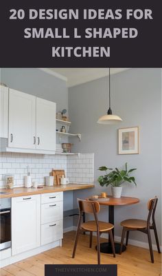 L-shaped kitchen with white cabinets, a small round table with two chairs, and modern decor.