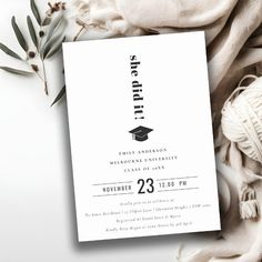 a white graduation party card with an image of a cap and tassel on it