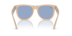 Ray-Ban Wayfarer Reverse glasses seamlessly blend the iconic square shape with a modern twist. These shades feature a polished opal beige & honey frame made from molded acetate, offering superior durability and comfort. The light blue lenses add a touch of color to your look while providing excellent protection against harmful UV rays. With their unique design and high-quality materials, these frames are a stylish addition to any wardrobe. Beige Sunglasses With Gradient Lenses For Beach, Beige Wayfarer Sunglasses With Tinted Lenses, Beige Wayfarer Sunglasses With Gradient Lenses, Beach Wayfarer Shield Sunglasses With Gradient Lenses, Blue Polarized Aviator Sunglasses For Beach, Wayfarer Ray Ban, Ray Ban Wayfarer, Unique Opal, Designer Eyewear