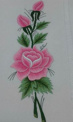 a drawing of pink roses with green leaves on a white paper towel, which has been embroidered onto it