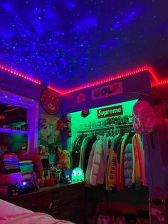 a room filled with lots of clothes and neon lights on the ceiling over it's closet