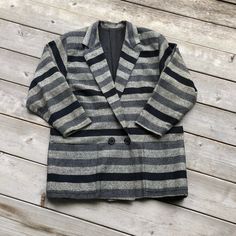 "Vintage 80s blazer in a great grey and black striped pattern. Oversized 80s look. Double breasted. Has two front pockets and is fully lined. Feels like wool but there is no content tag so it could be a blend. In good condition with general fading and some light piling.  Fits S - M best  42\" pit - pit  17\" shoulder - shoulder  28\" total length  19\" sleeve (meant to end just before the wrists)" Oversized Striped Fall Outerwear, Oversized Striped Outerwear For Fall, Striped Oversized Outerwear For Work, Vintage Striped Winter Outerwear, Retro Striped Outerwear For Work, Striped Retro Outerwear For Work, Boxy Blazer, 80s Blazer, 80s Look