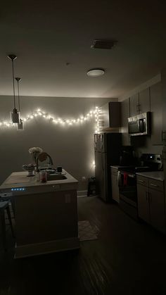 a kitchen with some lights on the wall