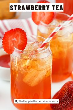 two glasses filled with strawberry tea on top of a table