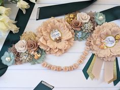 some flowers and ribbons are laying on the table