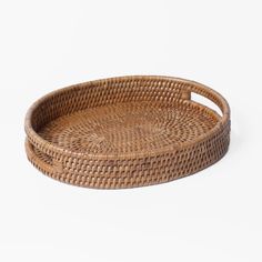 a round wicker tray on a white background