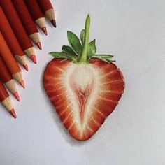 a drawing of a strawberry and some colored pencils