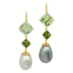 One-of-a-kind earrings of prasiolites, green tourmalines, South Sea and Tahitian pearls, and diamonds, handcrafted in 18 karat yellow gold. These beautiful drop earrings boast perfectly mismatched grey Tahitian and white South Sea pearls, with gorgeous shades of green and diamonds. These elegant beauties will dress up any look, as they dangle and sway as you move. The mismatched pearls bring a touch of whimsical fun to this modern pearl look! Tahitian Pearls Jewelry, Green Accessories, Earrings For Sale, Pearl And Diamond Earrings, Diamond Earring, South Sea Pearls, Sea Pearls, Tahitian Pearls, Pearl Diamond