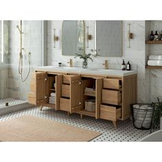 a bathroom with a sink, mirror and bathtub next to a walk in shower