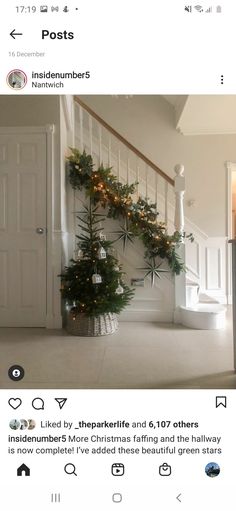 the christmas tree has been decorated with lights and garlands on it's branches