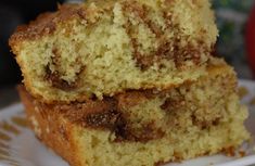 two pieces of cake sitting on top of a white plate