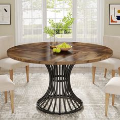 a dining table with chairs around it and fruit on the plate in front of them