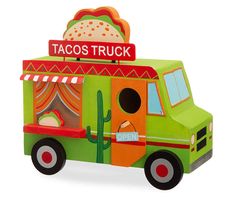 a wooden toy truck with a taco truck sign on top