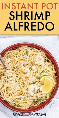 the instant pot shrimp alfredo in a red bowl with lemon wedges