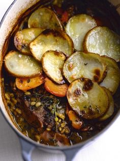 a pot filled with cooked vegetables on top of a table