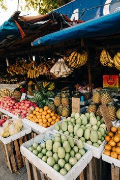 various fruits and vegetables are on display for sale