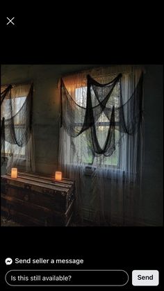 a room with two windows and some curtains