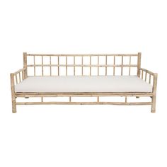 a wooden bench with white cushions on it