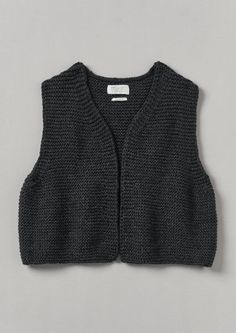 a black sweater vest on a gray background