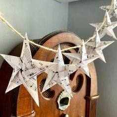 some paper stars are hanging from a string