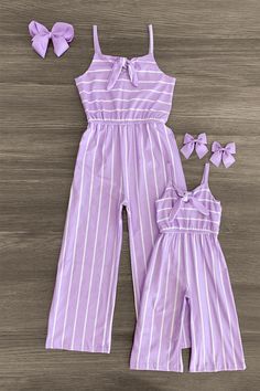 Mom & me tank sleeve jumpsuits feature an allover striped design Both jumpsuits feature a cinch waist for a feminine fit Ultra-soft breathable fabric makes it an easy wear all day long Comes in Lavender, Plum & Pink You and your little one will look amazing twinning in our Stripe Jumpsuits. It's a one piece complete outfit! This jumpsuit is the perfect pick for any busy day on the go. The stretchy and soft fabric helps comfort and fit and can be great for all day wear. This capri-length jumpsuit Mom And Daughter Outfits, Matching Mommy Daughter Outfits, Mom Inspo, Ella Jane, Kids Outfits Daughters, Book Outfits, Mom Daughter Outfits, Mommy Daughter Outfits, Daughter Dress