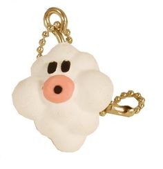 a key chain with a white dog face on it