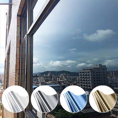 there are four different colors of glass on the window sill in front of buildings