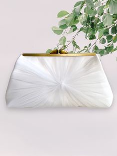 "This clutch features a beautiful tulle and satin fabric for the exterior and optional personalized photo lining and inscription on the inside. An elegant gift for the bride, bridesmaid, mother or mother in law. Perfect purse to carry on your wedding day.  Dimensions: 5\" high 7\" across the top  8.5 across bottom  2.5\" deep Gold color metal clasp opening on top.  Exterior fabric: satin and tulle Interior fabric: Off white cotton. If you would like different color, please contact to request.  P Elegant Tulle Bridal Accessories, Elegant Evening Bridal Accessories With Tulle, Elegant Evening Bridal Accessories In Tulle, Elegant White Tulle Fabric For Ceremony, Elegant Tulle Bridal Accessories For Evening, Elegant Evening Tulle Bridal Accessories, Elegant Organza Bridal Accessories For Ceremony, Wedding Evening Bag With Satin Lining, Elegant Evening Bag With Satin Lining For Wedding