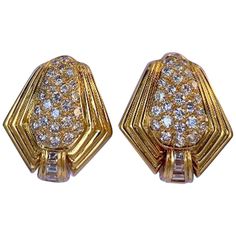 Very elegant, pair of custom hand made, 18 karat yellow gold Art Deco angular design diamond clip on earrings feature 28 pave set round brilliant diamonds in each earring that are accented on the bottom with three baguette diamonds that graduate in size. Surrounding the earrings is a wide ribbed border giving the earrings the stylish Art Deco look. Earrings can be converted to pierced earrings (upon request) by simply just adding a post. Total combined weight of the 62 diamonds is approximately Double Stud Earrings, Mens Diamond Jewelry, Modernist Earrings, Pink Sapphire Earrings, Pave Diamond Earrings, Sapphire And Diamond Earrings, Hammered Earrings, Stylish Art, Pearl And Diamond Earrings