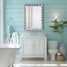 a bathroom with blue walls and white fixtures