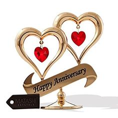 two hearts are on top of each other with the words happy anniversary written in gold