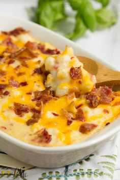 a casserole dish with cheese and bacon