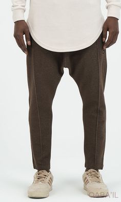 QL Relaxed Trousers City in Brown Description: QL Relaxed Trousers City are meant for comfort and style. Another sporty classic outfit that is movable and breathable. Designed with an elastic waistband with an adjustable drawstring for a custom fit and zipped side pockets. These trousers are structured and unfussy, perfect for any casual day with a sporty and active vibe. Modern Islamic clothing for men Very high-quality fabric from top brands Elastic waist with drawstring closure With two side Brown Stretch Bottoms For Streetwear, Stretch Brown Bottoms For Streetwear, Urban Ankle-length Pants For Fall, Urban Brown Pants For Fall, Athleisure Brown Pants For Fall, Brown Athleisure Pants For Fall, Urban Brown Relaxed Fit Bottoms, Brown Urban Relaxed Fit Bottoms, Urban Tapered Leg Bottoms For Fall