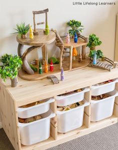 a child's play area with toys and potted plants on the top shelf