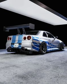 a white and blue car parked in a garage