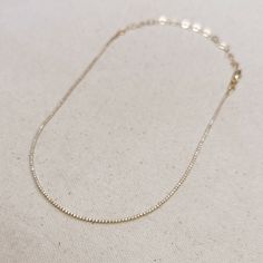 Adorn your neck with this stunning 18k Gold-filled Tennis necklace. Delicate and minimalist, its classic look is sure to make a statement. Our 1.2mm Cubic Zirconia stones shine brightly, making this the perfect accessory for any outfit. Metal: 18k Gold Filled High-quality AAAAA Cubic Zirconia Material: 1.2mm micro CZ chain Size: 12 inches long + 4 inches extender chain Hypoallergenic Water-resistant Handcrafted in Brazil Also available our matching Tennis Bracelet to complete your outfit. Minimalist Diamond Tennis Necklace As Gift, Minimalist White Gold Tennis Necklace Gift, Minimalist Cubic Zirconia Tennis Necklace, Elegant Tennis Necklace With Delicate Chain As Gift, Fine Jewelry Tennis Necklace With Adjustable Chain As Gift, Everyday Adjustable Cubic Zirconia Chain Necklace, Dainty White Gold Tennis Necklace Gift, Minimalist Diamond Tennis Necklace, Minimalist Yellow Gold Tennis Necklace Gift