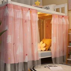 there is a pink canopy bed with curtains on the top and bottom bunk above it