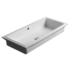 the bathtub is white and has black trimmings on the sides, along with an under - mount faucet