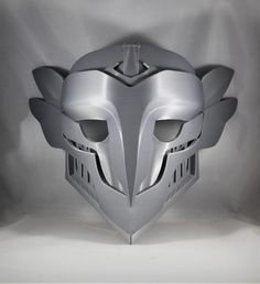 the helmet is designed to look like it has been made out of metal and silver