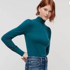 Per J.Crew: This Easy Turtleneck Pullover With Pretty Puff Sleeves Is Made Of Supersoft Tencel Lyocell, A Fiber That's Produced From Wood Pulp Sourced From Sustainably Managed And Certified Forests (Meaning Not Ancient Or Endangered!) Then Put Through A Closed-Loop Production Process That Recycles Water And Solvents. The Result Is A Soft, Stretchy Fabricsomewhere Between A Heavy Tee And A Light Sweaterthat's Naturally Soft And Breathable. Tencel Lyocell/Poly/Elastane. Machine Wash. Item Ae771. P Green Fitted Casual Turtleneck, Green Turtleneck Top For Fall, Fall Green Turtleneck Top, Casual High Neck Tops For Fall, Casual Fitted Mock Neck Top For Fall, Fitted Casual Mock Neck Top For Fall, Trendy High Neck Tops For Fall, Trendy Fall Tops With Funnel Neck, Trendy Funnel Neck Tops For Fall