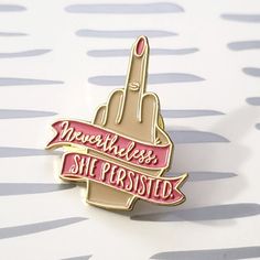 there is a pink and gold pin with the words, we're fearless she posted