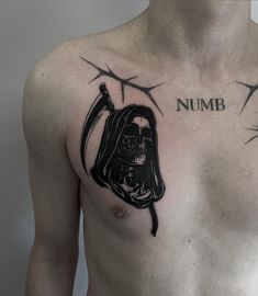 a man with a tattoo on his chest