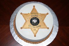 a cake with a police badge on it