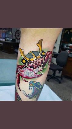 a man with a crab tattoo on his leg